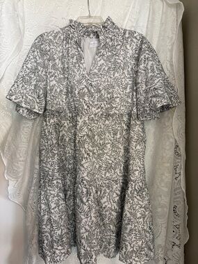 Shop the Mint Ruffle Neck Mini Dress in White & Gray Floral